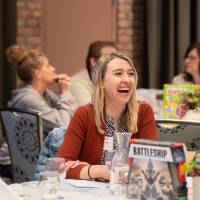 people laughing at table photo 3